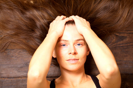 belarus, minsk, 2021. illustrative editorial doterra oil in hand womanのeditorial素材