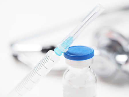 bottle vaccine and syringe. medicine stethoscopeの写真素材