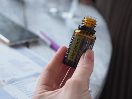 Close up of a female hand holding a medical ampoule.のeditorial素材