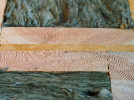 mineral insulation in the wooden wall of the house frame constructionの写真素材
