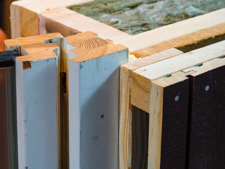 mineral insulation in the wooden wall of the house frame construction