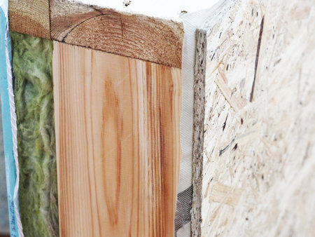 mineral insulation in the wooden wall of the house frame constructionの写真素材