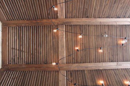 wooden screen decorated with light bulbsの写真素材