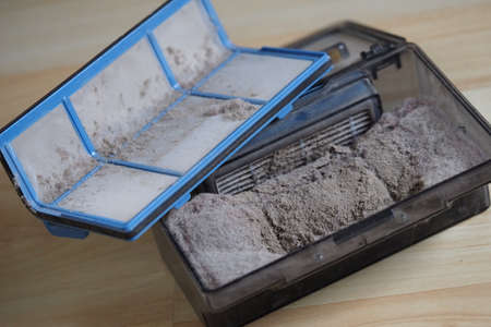 Dust-filled replaceable plastic container of the robot vacuum cleaner