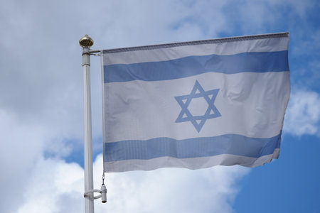 national flag country israel waving blue skyの写真素材