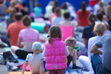 Belarus, Minsk, 2016.people doing exercise in the park during the international yoga day festivalのeditorial素材