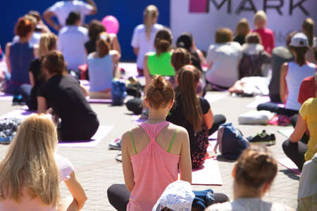 Belarus, Minsk, 2016.people doing exercise in the park during the international yoga day festival