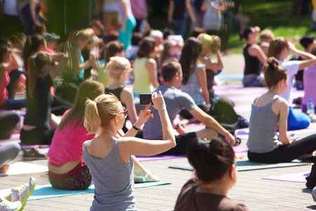 Belarus, Minsk, 2016.people doing exercise in the park during the international yoga day festival