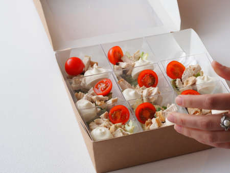 set sandwiches in cardboard packaging in portions in catering services deliveryの写真素材