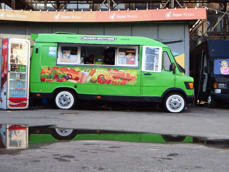 belarus, minsk, 2021.coca-cola brand logo on city. editorial images popular food playground city sandbox. people buy food in food truckのeditorial素材