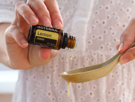 doterra home essential lemon oil used womanのeditorial素材