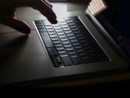 Belarus, Minsk, 2022.macbook pro 16 close up new laptop keyboard close upのeditorial素材