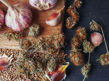 weed buds and garlic. medical marijuanaの写真素材