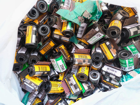 Old 35 mm film strip in recycling bin.