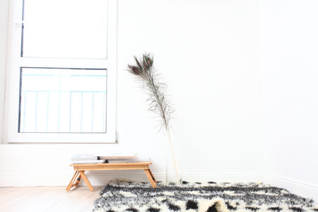 Interior of a modern living room with a wooden chair and a carpetの写真素材