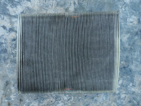 Car air filter on grunge metal background. Top view. Copy space.の写真素材