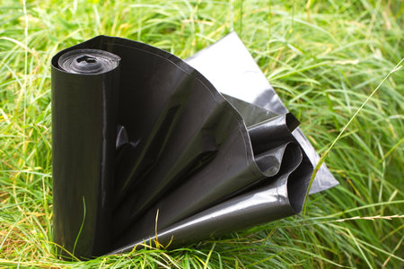 garbage bag close up in grassの写真素材