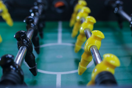 Table football game with yellow and black players. Close-up.の写真素材