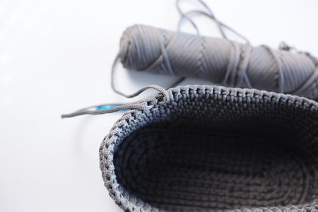 Knitting needles and wool yarn on a white background close-upの写真素材