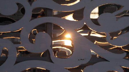 Close up of a white lantern on the street in the evening.