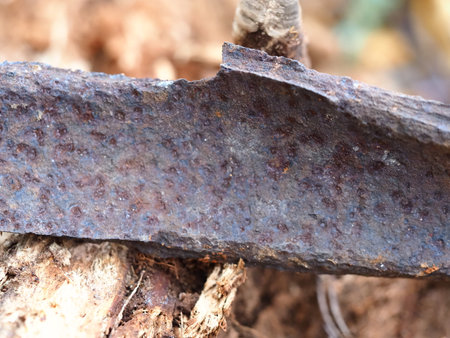 rusty, sharp-edged fragment of an old mine shellの写真素材