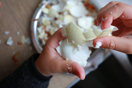 child's hands preparing food close upの写真素材