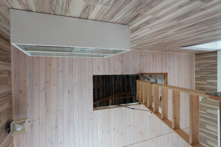 Interior of a modern house, view from the wooden stairs.の写真素材