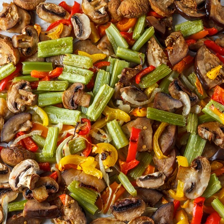 Background of fried vegitables mushrooms and sweet papperの写真素材