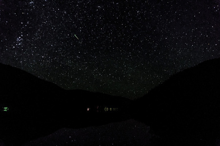 Many starts on blue dark night sky as a cosmos backgroundの写真素材