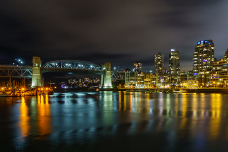 Vancouver Canada - December 15, 2017: Burrard bridge and Vancouver Downtown at night time view from Granville Islandのeditorial素材
