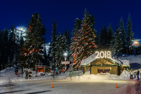 North Vancouver Canada - December 30, 2017: Ice skating rink, fun and entertainment at Grouse Mountain.のeditorial素材