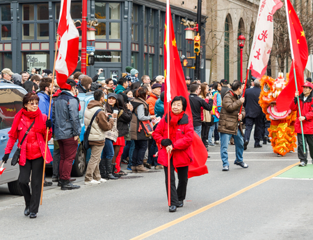 VANCOUVER, CANADA - February 2, 2014: People marching at Chinese New Year parade in Vancouver Chinatownのeditorial素材