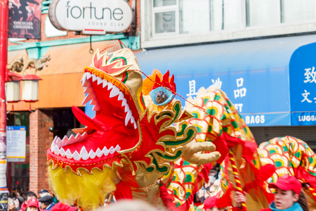 VANCOUVER, CANADA - February 2, 2014: People playing dragon dance for Chinese New Year in Chinatownのeditorial素材