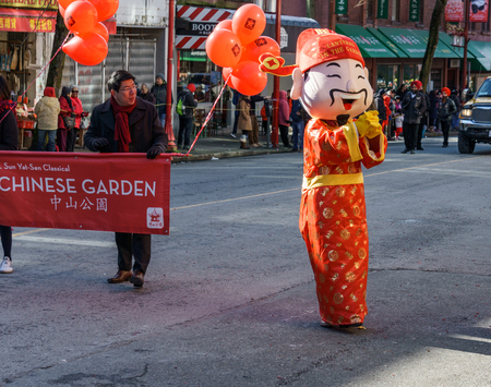 VANCOUVER, CANADA - February 18, 2018: God of Wealth in Vancouver Chinatown during the Chinese New Year celebration.のeditorial素材