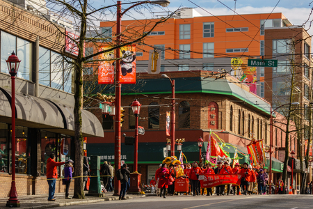 VANCOUVER, CANADA - February 18, 2018: People marching at Chinese New Year parade in Vancouver Chinatownのeditorial素材
