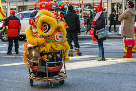 VANCOUVER, CANADA - February 18, 2018: Lion Costume on the drum at Chinese New Year parade in Vancouver Chinatownのeditorial素材