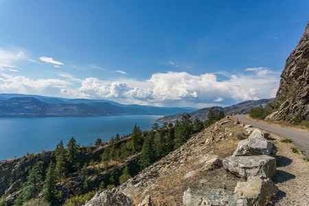 Okanagan lake at summer day with clouds on the skyの写真素材