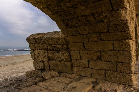 Ancient Roman ruins of aqueduct in Ceasarea Israel historical monumentの写真素材
