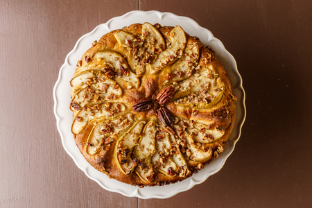 pear cake homemade pastries on a white dish on tableの写真素材