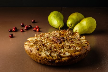 pear cake homemade pastries on a white dish on tableの写真素材