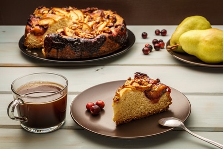 pear cake homemade pastries on a black plate on table