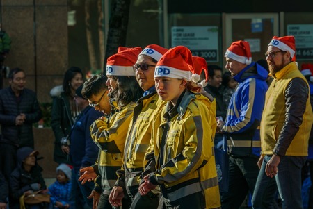 VANCOUVER, CANADA - DECEMBER 2, 2018: people participating in annual The Santa Claus Parade in...
