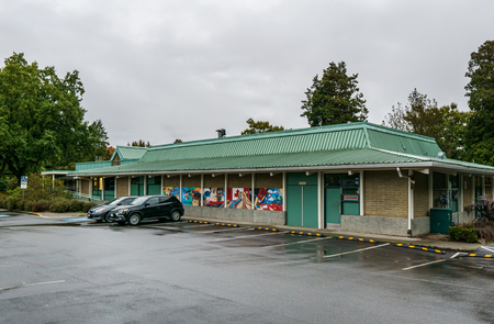 VANCOUVER, CANADA - SEPTEMBER 21, 2018 - Douglas Park Community Centre with parking lot in rainy dayのeditorial素材