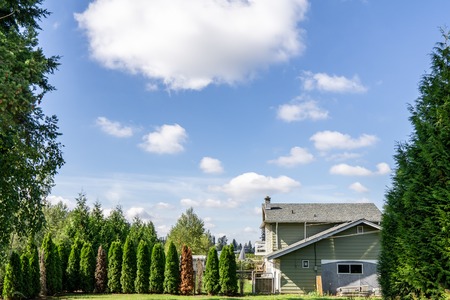 Aldergrove, Canada - September 18, 2018: House in the country at sunny day with clouds on skyのeditorial素材
