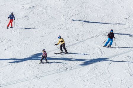 KIMBERLEY, CANADA - MARCH 22, 2019: Mountain Resort view early spring people skiingのeditorial素材