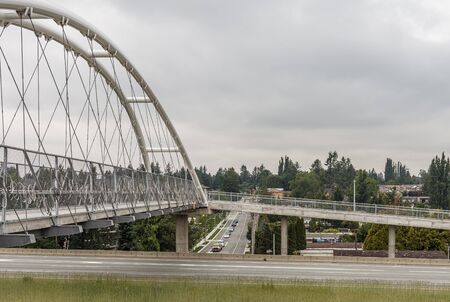 ABBOTSFORD, CANADA - MAY 29, 2019: pedestrian and bicycle bridge over the highwayのeditorial素材