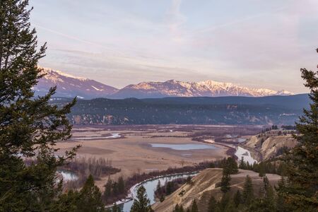 early spring morning at columbia river valleynear Radium Hot Springs with rocky mountains on the...