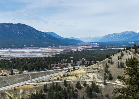 Radium Hot Springs, CANADA - MARCH 23, 2019: Overlooking the town from the mountain top Rocky Mountains on the backgroundのeditorial素材