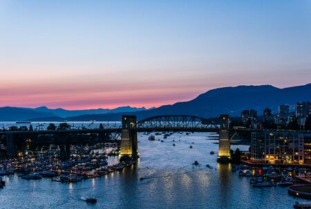 VANCOUVER, CANADA - AUGUST 3, 2019: famous Burrard street bridge at night.のeditorial素材