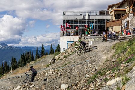 WHISTLER, CANADA - AUGUST 25, 2019: Mountain biking on top of the mountain.のeditorial素材